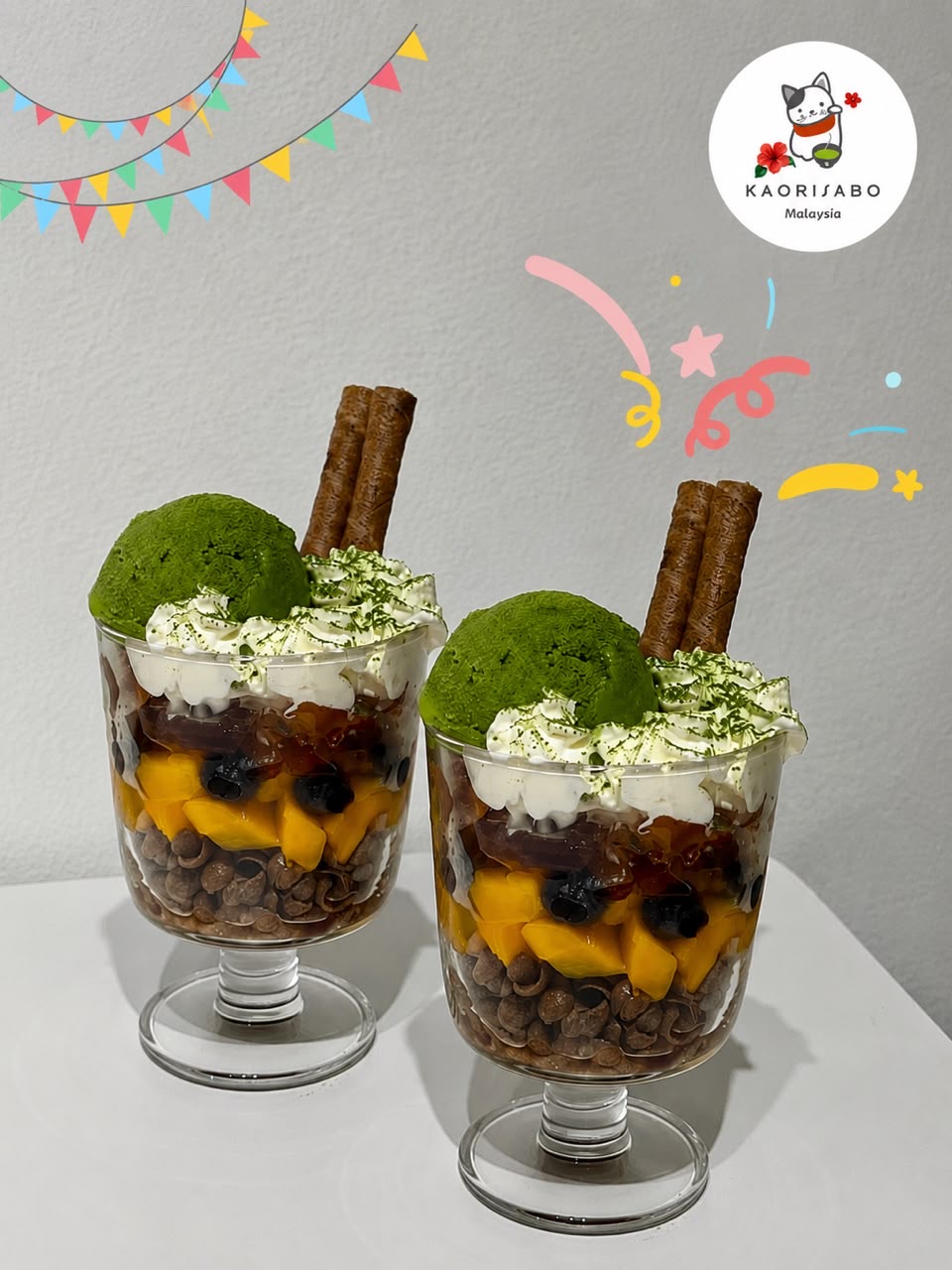 Matcha desserts topped with cream and wafer sticks